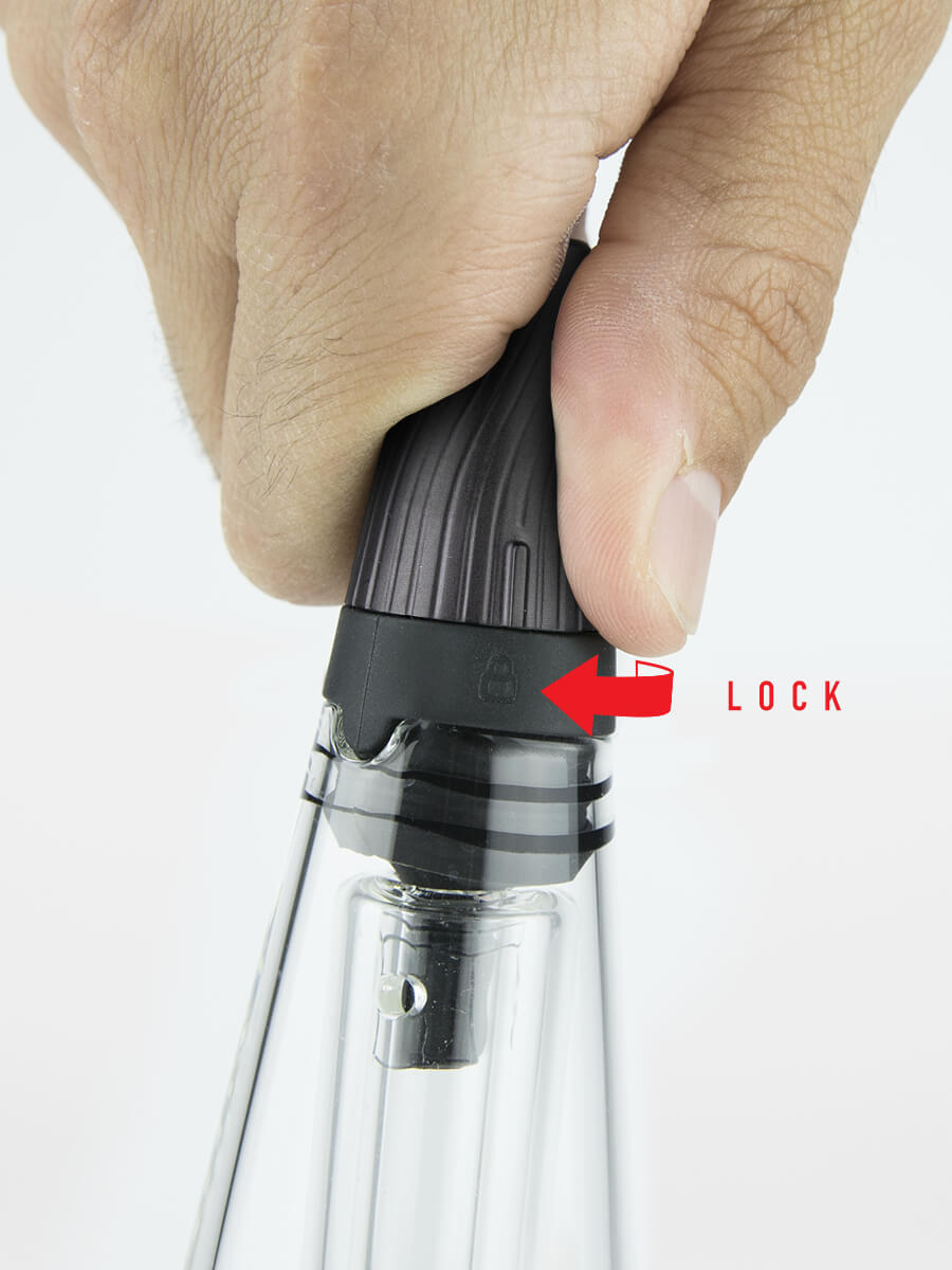 Hand adjusting mouthpiece on Puffco Peak Pro travel glass with a red left-facing arrow and "close" in red font