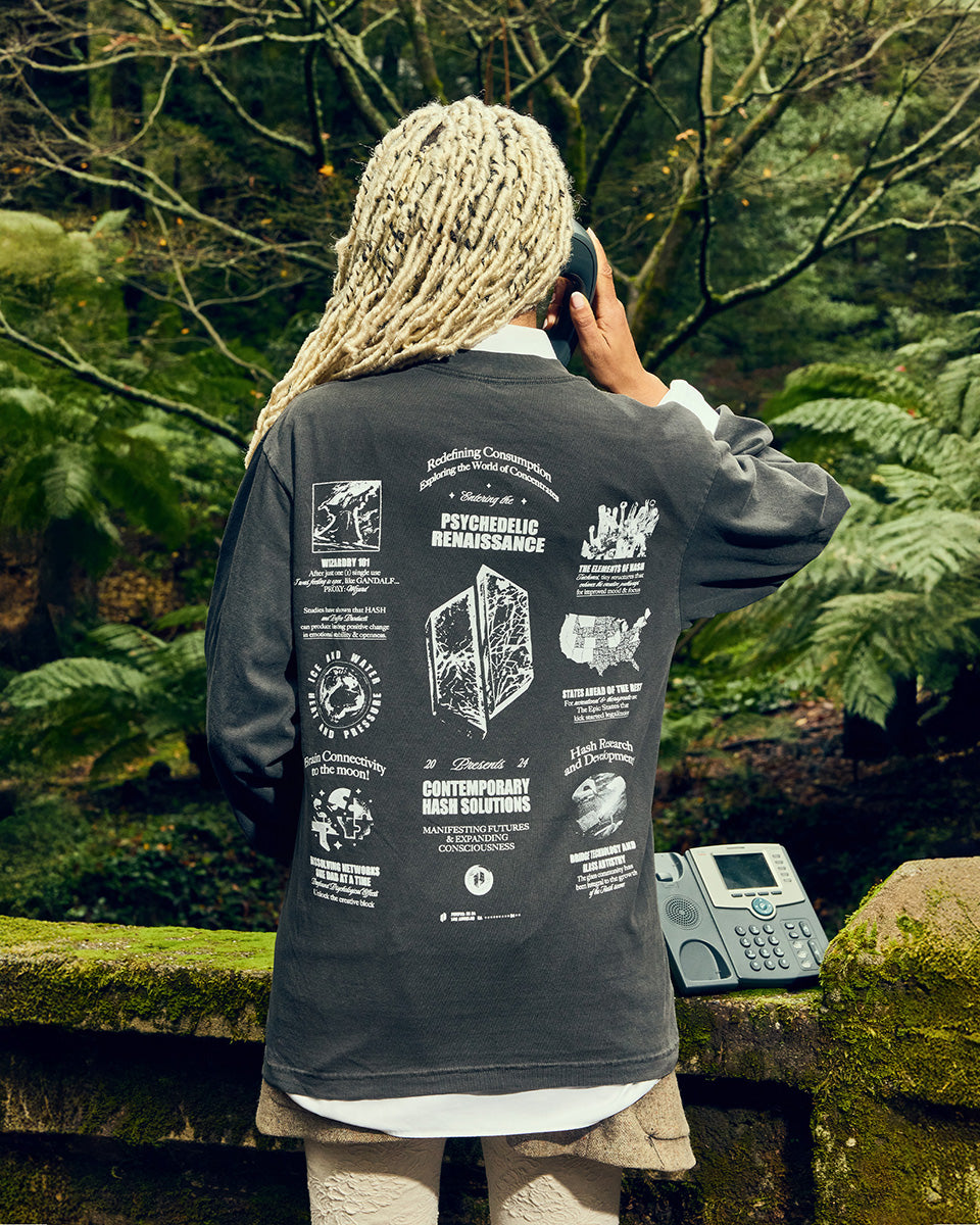 Back of a woman wearing the Puffco manifest shirt
