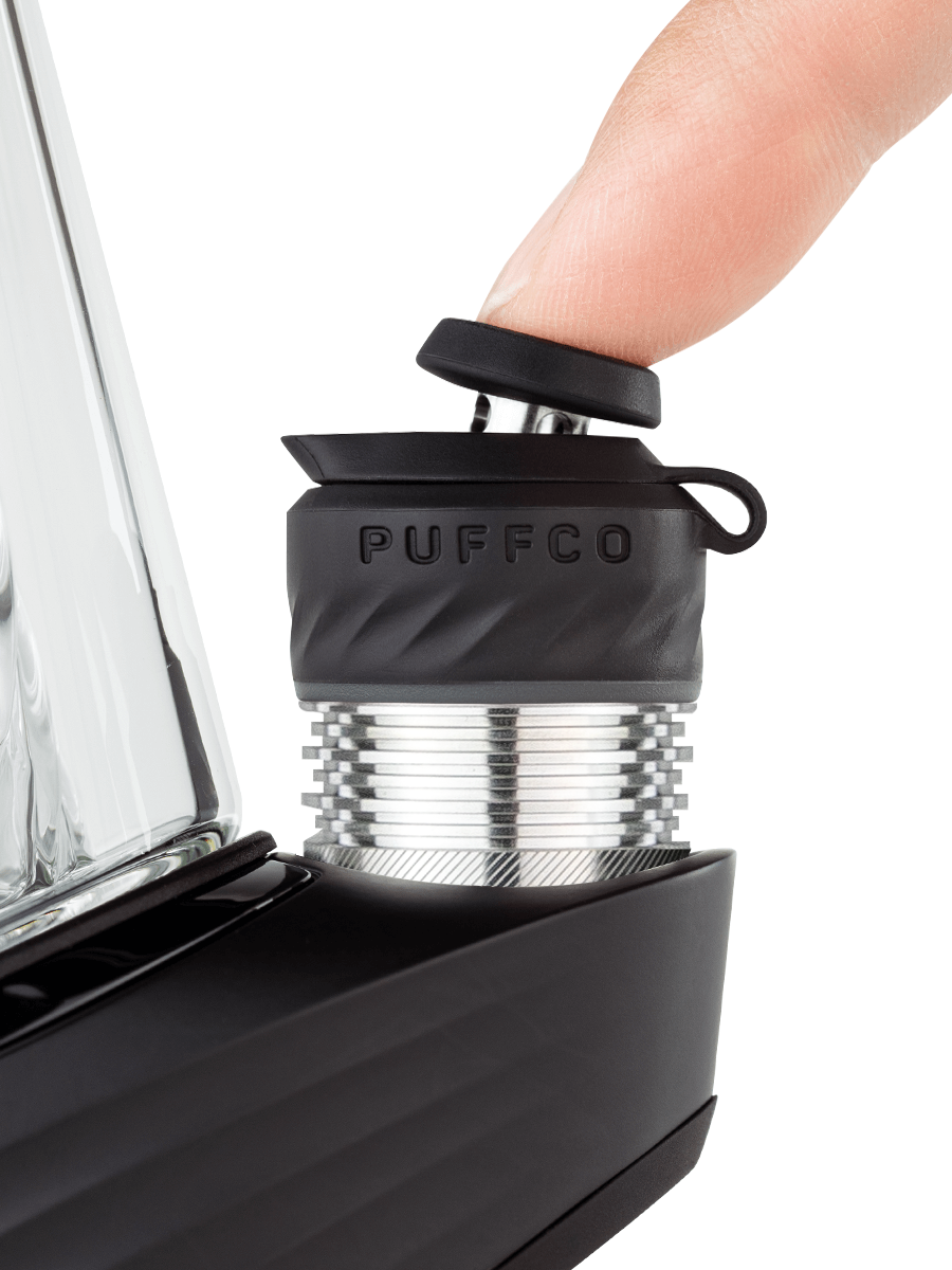 finger pressing black dab rig joystick
