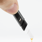 Downwards facing Puffco black dab hot knife with extract dripping off of white tip