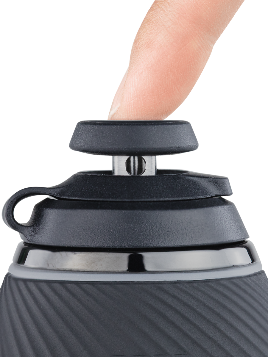 Close up side shot of black Puffco Proxy joystick cap connected to black base with finger on top