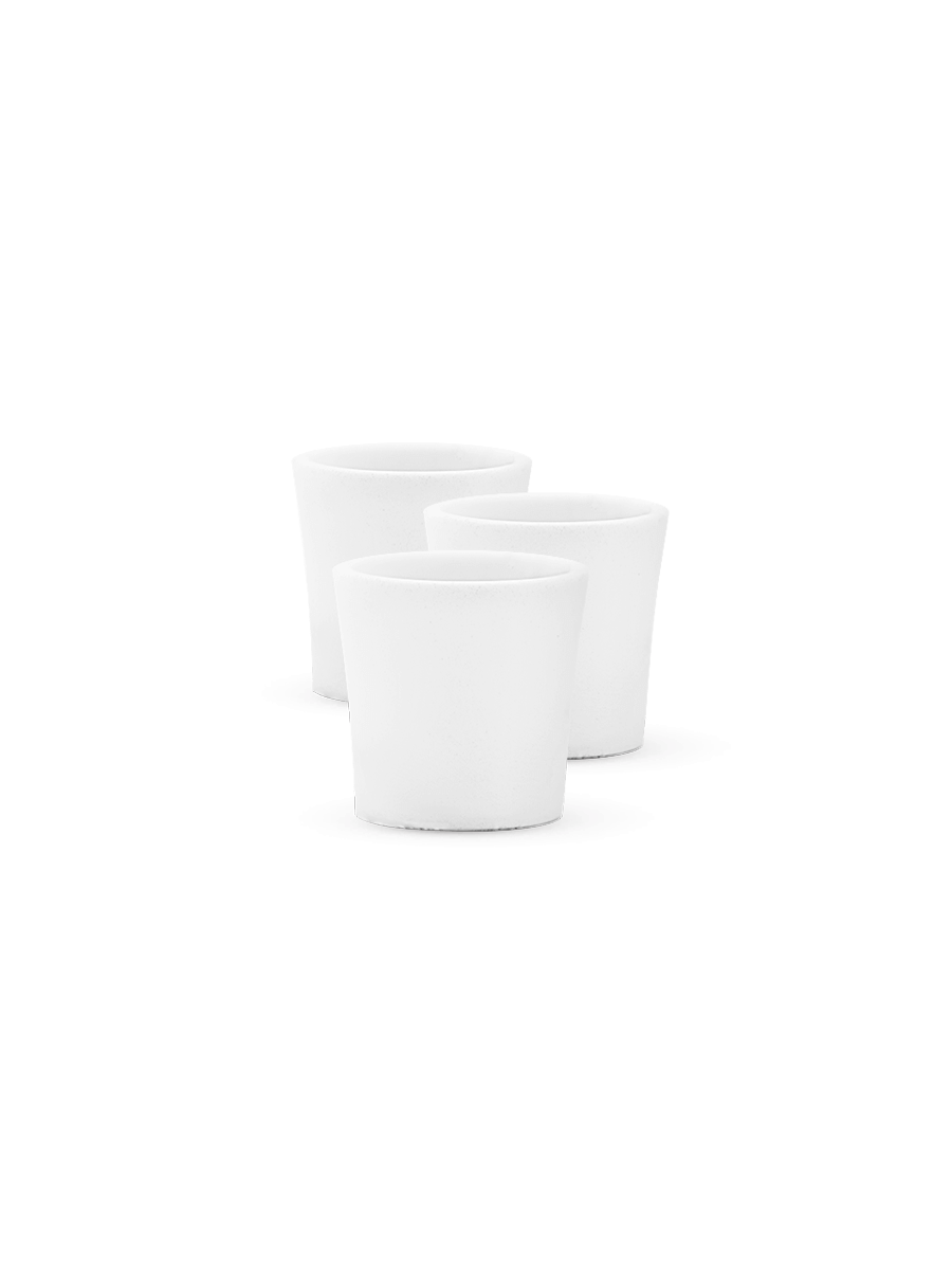 Front shot of three white Puffco Peak bowls lined up behind one another against white backdrop