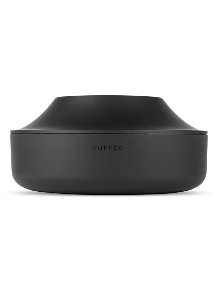 Front shot of black Puffco charging dock against white backdrop