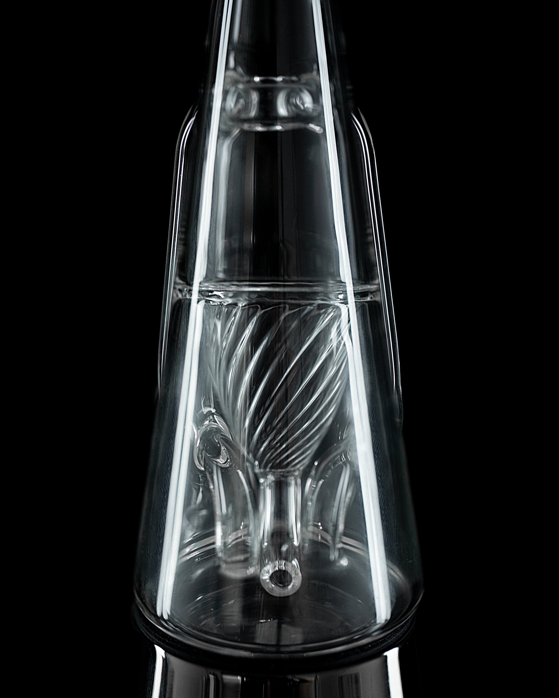 Close up shot from behind of Ryan Fitt glass against black backdrop