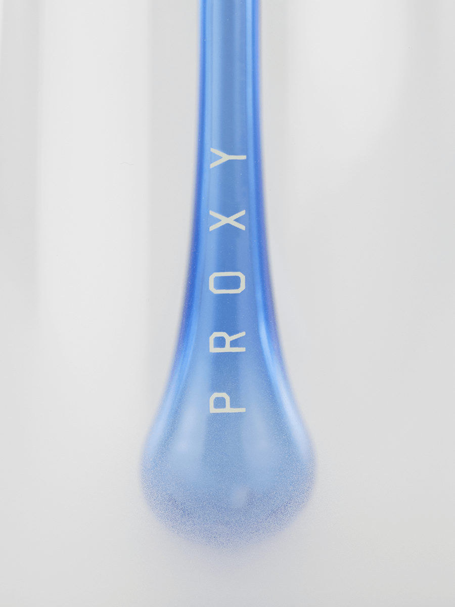 Close up of blue glass detailing and the word "PROXY" on Puffco Proxy Droplet