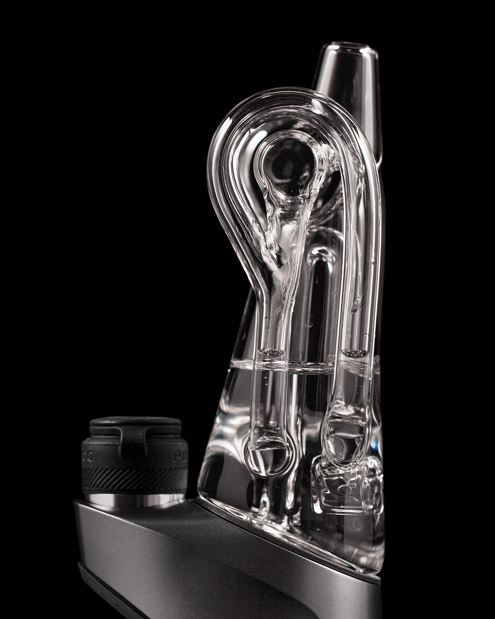 Close up side shot of Ryan Fitt recycler glass attached to black rig against black backdrop